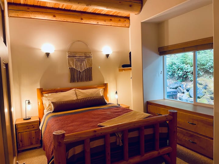 Main floor bedroom #1 with Queen bed, built in dresser, and closet cubby. 