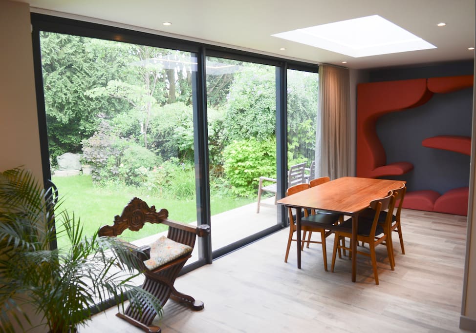 Sliding doors opening into garden for al fresco dining