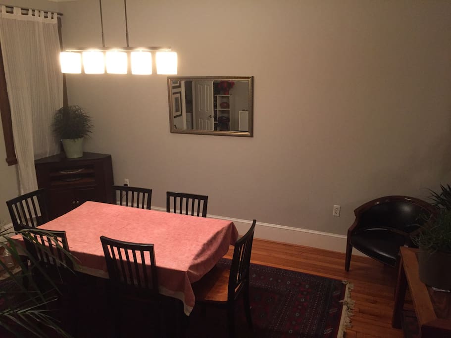 Main level - Dining room with table and six chairs. Three more chairs can be pulled up for more seating.