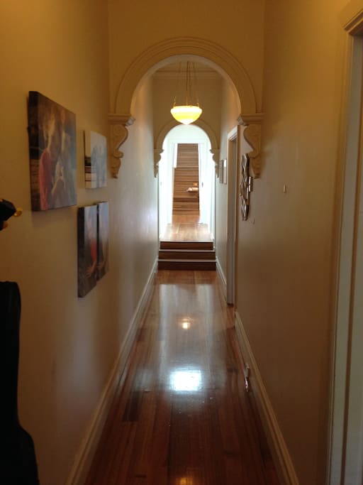 Gorgeous original hall way leading to new renovation.