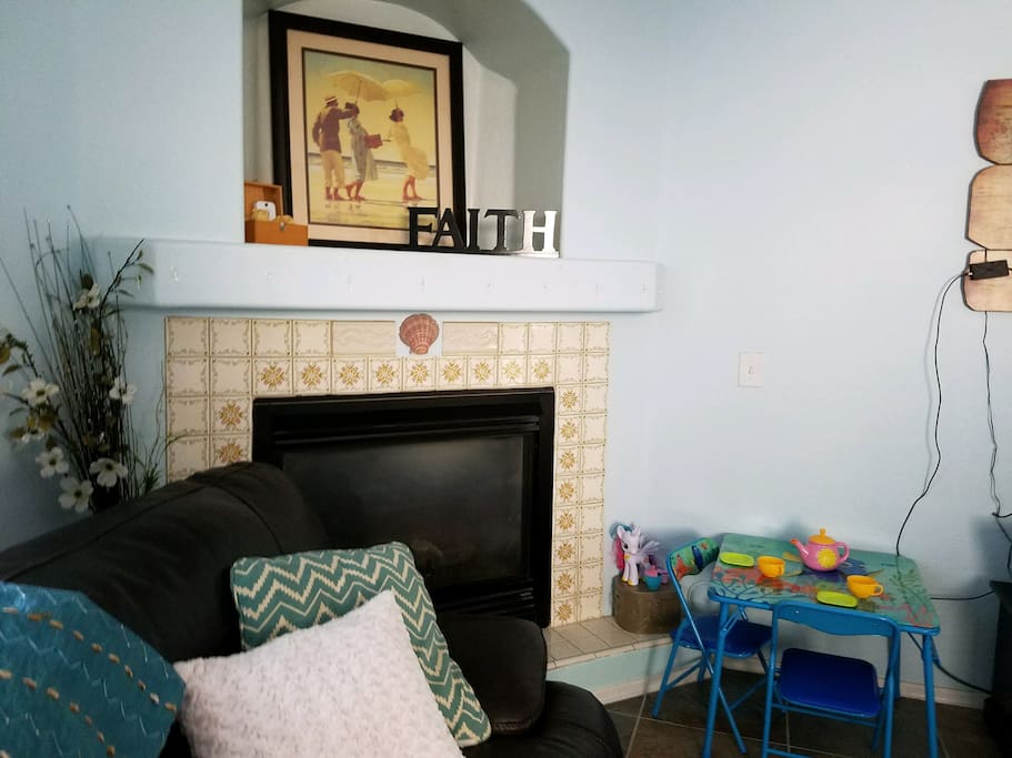 Living room fireplace and kid area