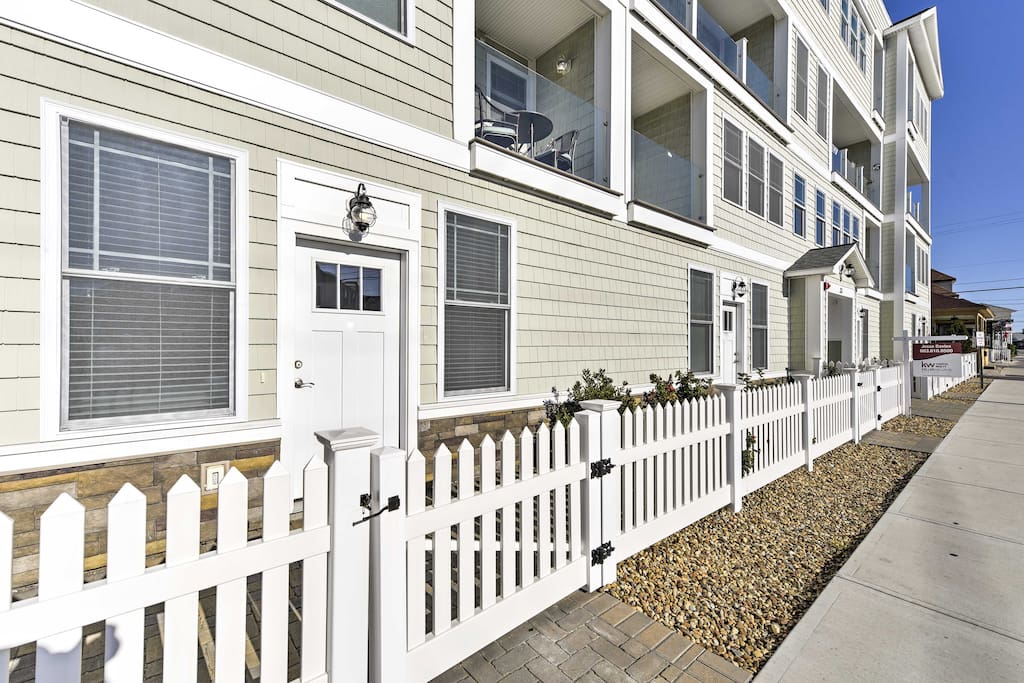A quaint white picket fence welcomes you to your getaway.