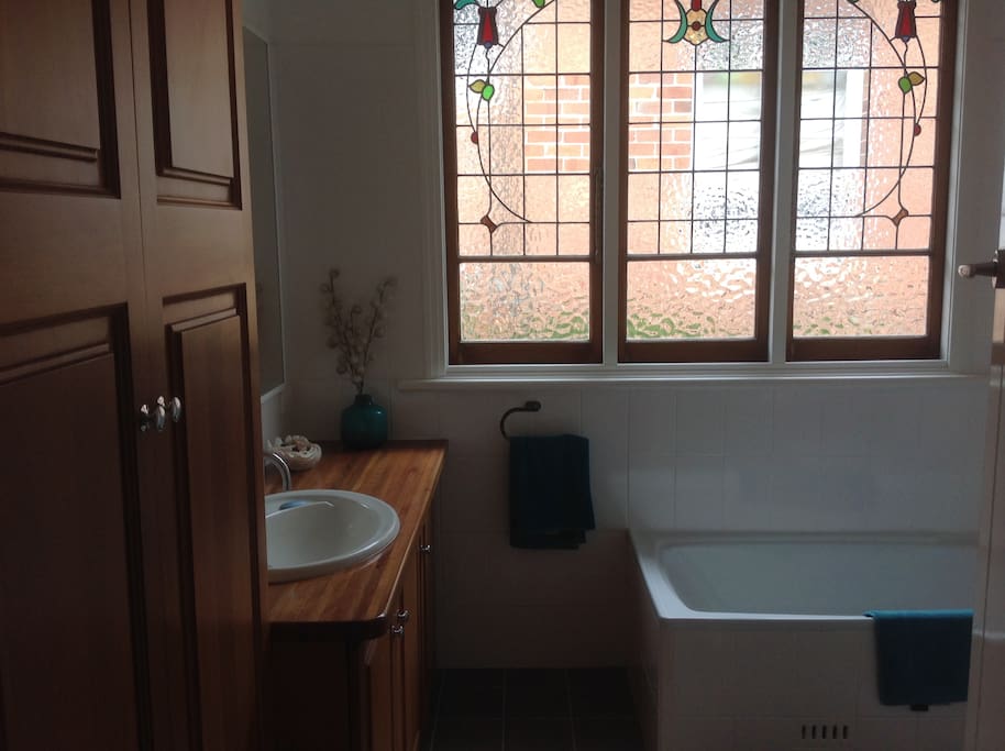 Bathroom with bath, toilet and separate shower