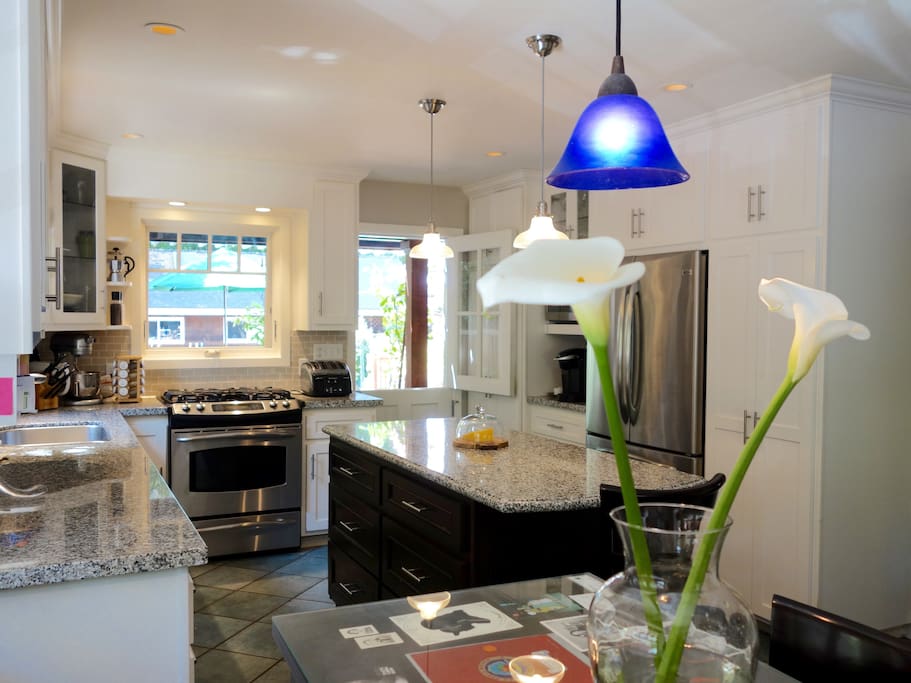 Large kitchen and alternative gathering spot to converse while cooking.