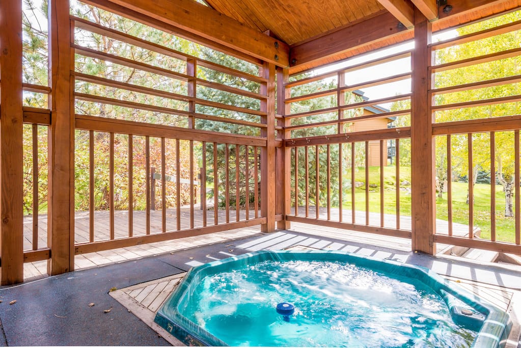 Relax in the shared outdoor hot tub.