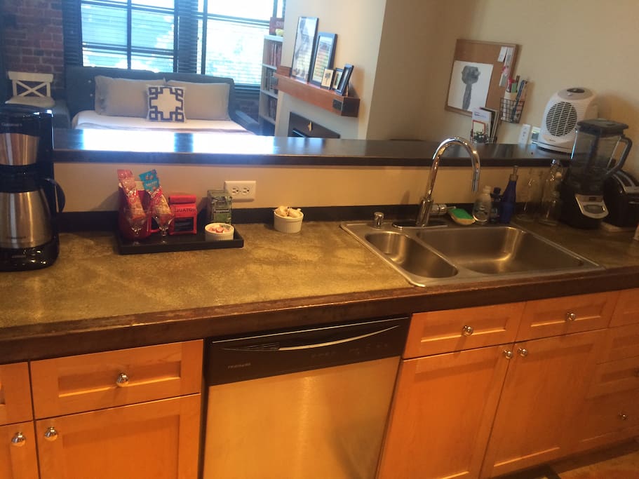 Kitchen is modern & well-equipped.