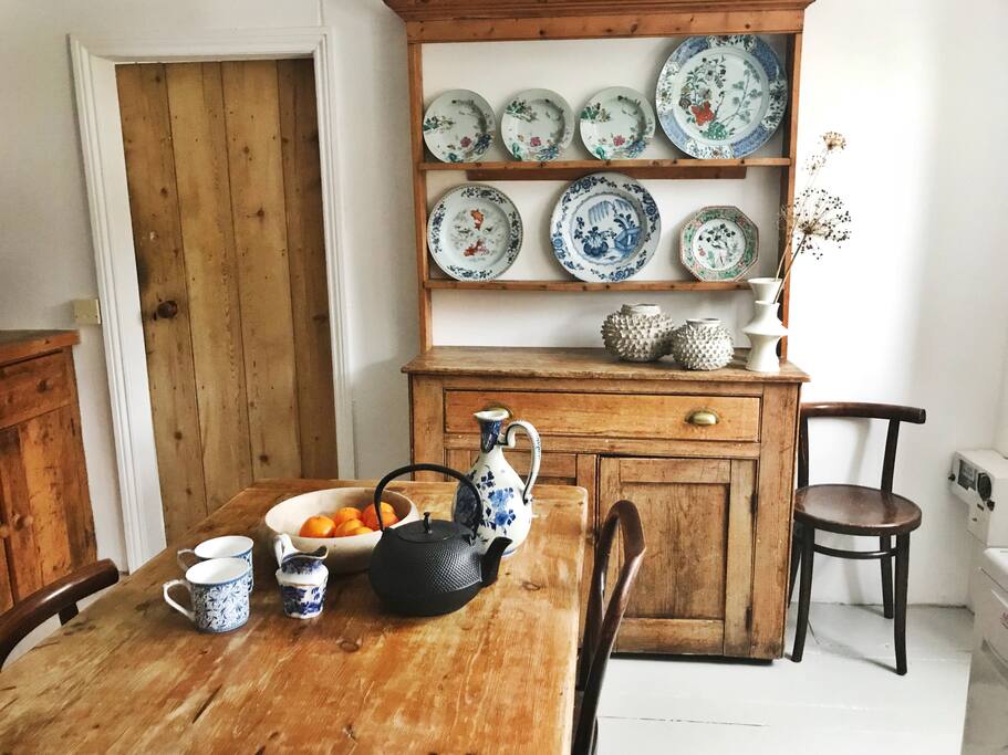Kitchen with farmhouse table and dressers.