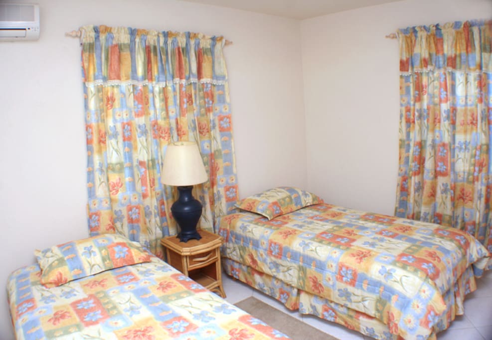 Bedroom with twin beds. May be connected to each other.