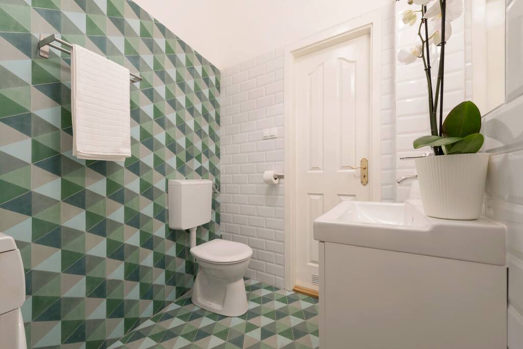 the apartment has 2 bathrooms, so the 3 bedrooms are sharing 2 bathrooms, we clean them everyday during your stay to keep them clean, the bathrooms have everything from hair dryer to a washing machine, which is at your disposal