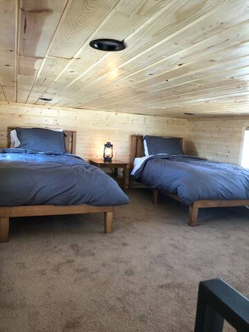 Spacious loft with 2 comfy beds accented with goose down duvet comforters