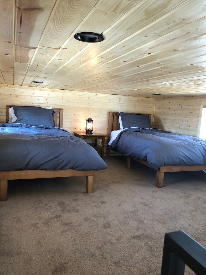 Spacious loft with 2 comfy twins beds accented with goose down duvet comforters