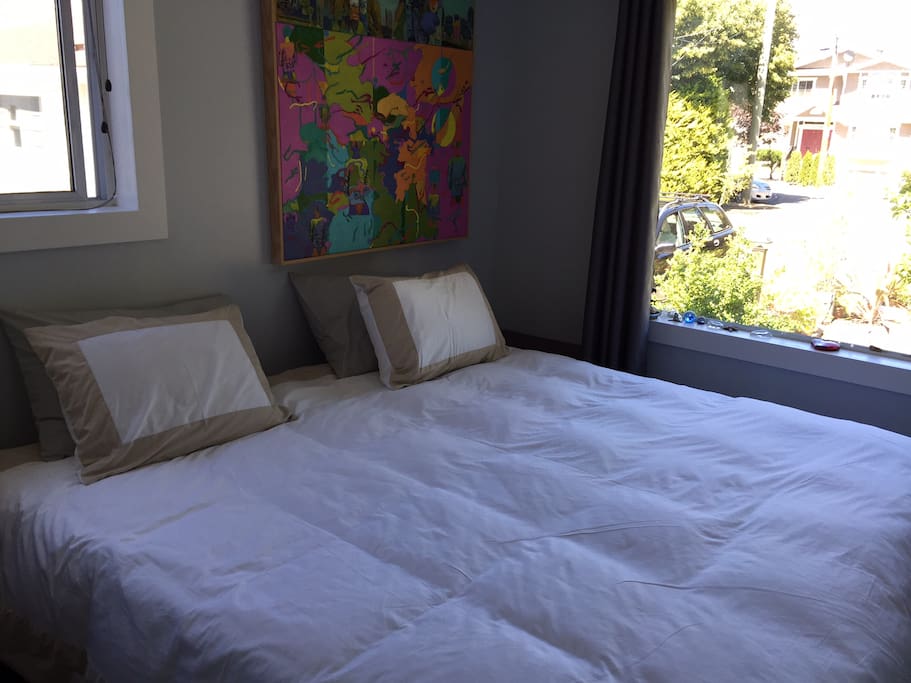 Comfortable Electric King Size Bed with 2 windows in Master Bedroom.