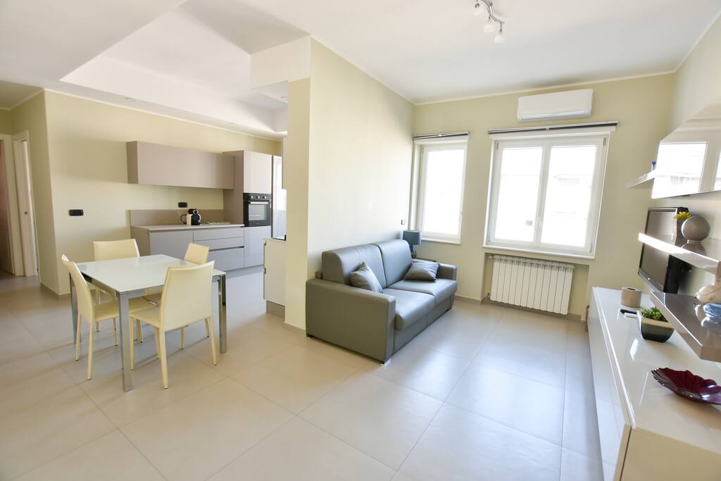 The fully-equipped living room with a comfortable double sofa bed