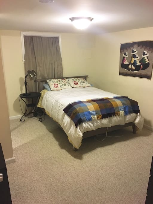 Full sized bed in separate bedroom.