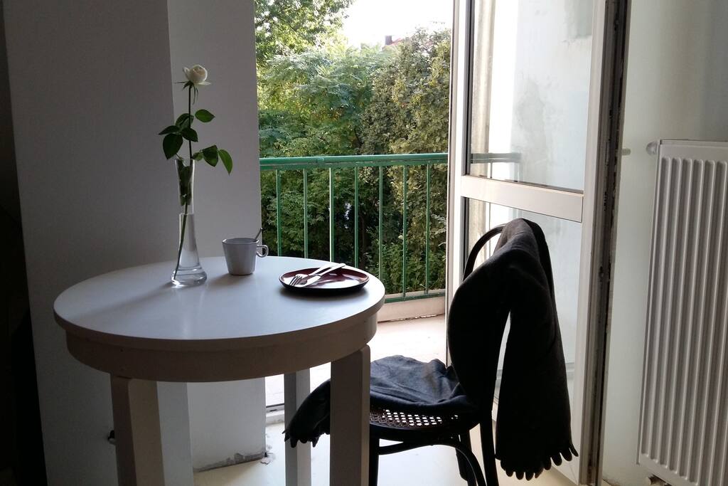 wooden table with a balcony view