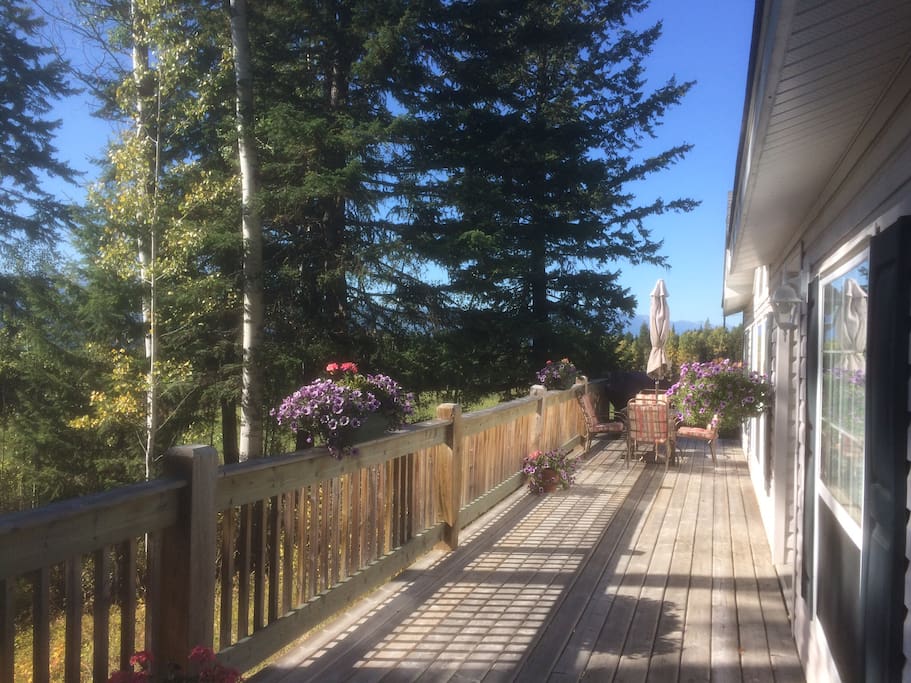 Spacious front deck with plenty of room for bbq, relaxing and viewing the 180 beauty