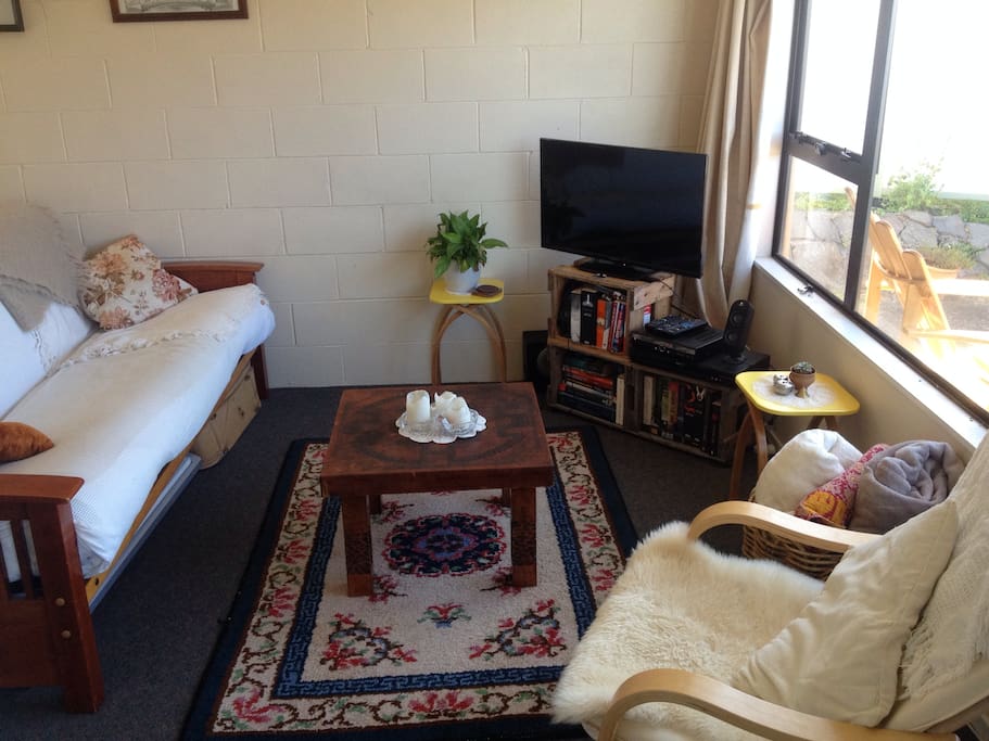 Living room with futon that folds out to a bed