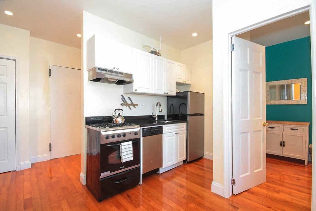 Kitchen-living room with sofa, TV and dining table