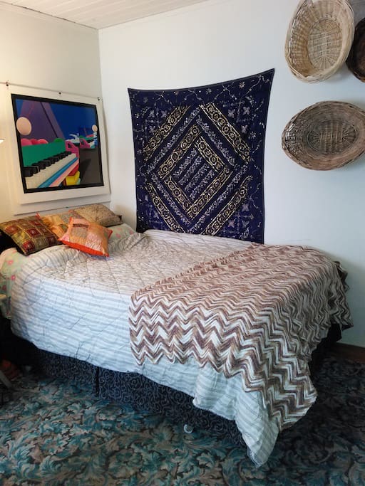 Queen size bed with memory foam mattress topper in second Bedroom.