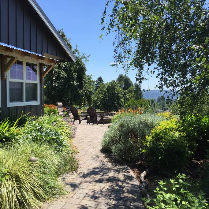 Path to my front door and shared patio area and fire pit.