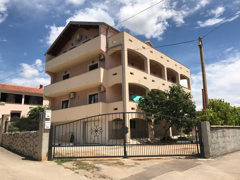 Entrance to home and apartment, parking available around the house, gated.