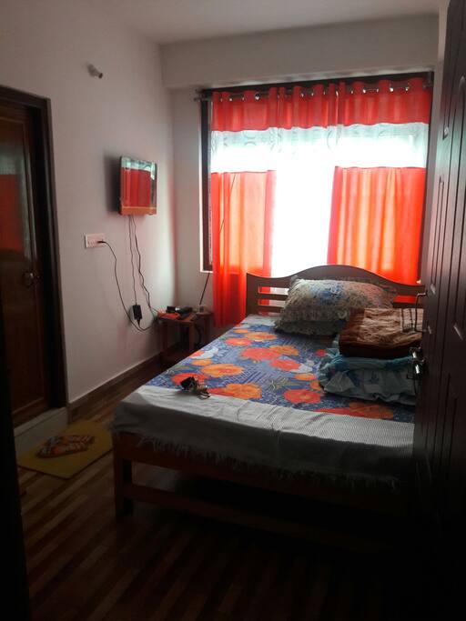 single room with double bed, tv, water boiler, private toilet/bathroom.