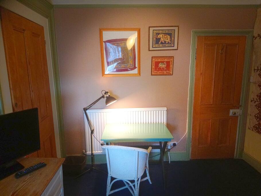 Desk is ideal for working, writing, eating.