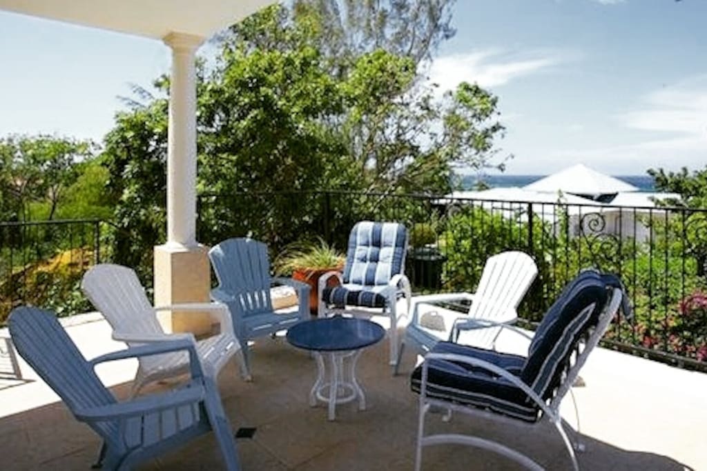 Spacious & scenic upstairs patio. Accessible via master bedroom and pool deck