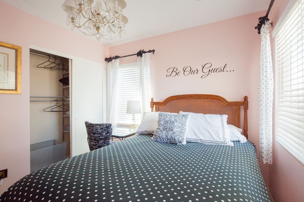 Cozy, romantic bedroom with a desk and closet space.