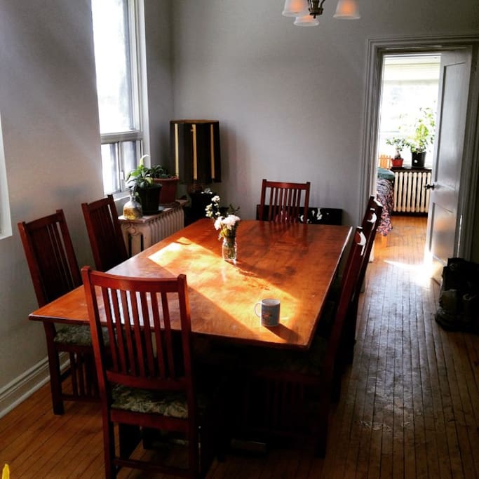 This is part of the kitchen with our huge dinner table. Sunny Bedroom in the background.
