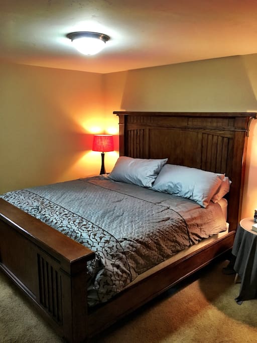 King sized bed and pillows with luxury bedding.