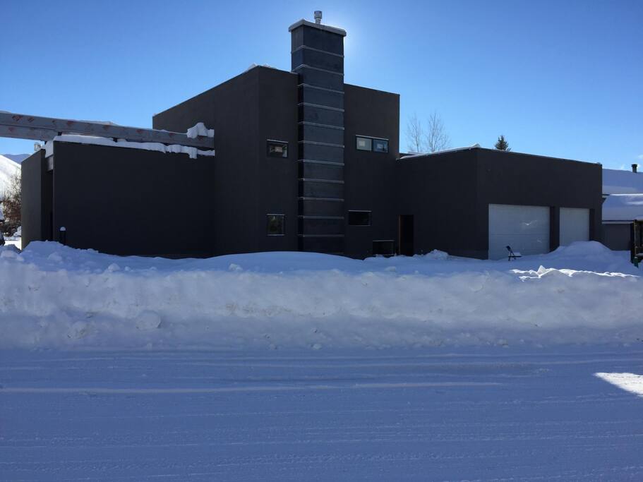 Front of house, entrance and studio to the left.
