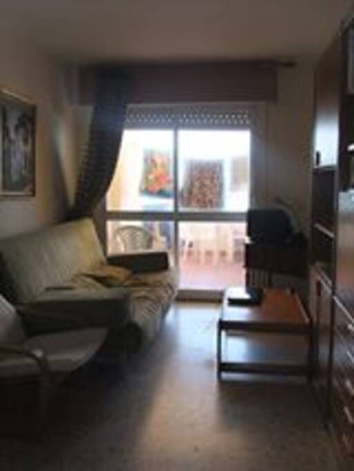 Part of a living room with access to the terrace.