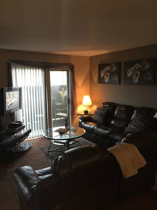 Living room with comfortable leather recliner sofas