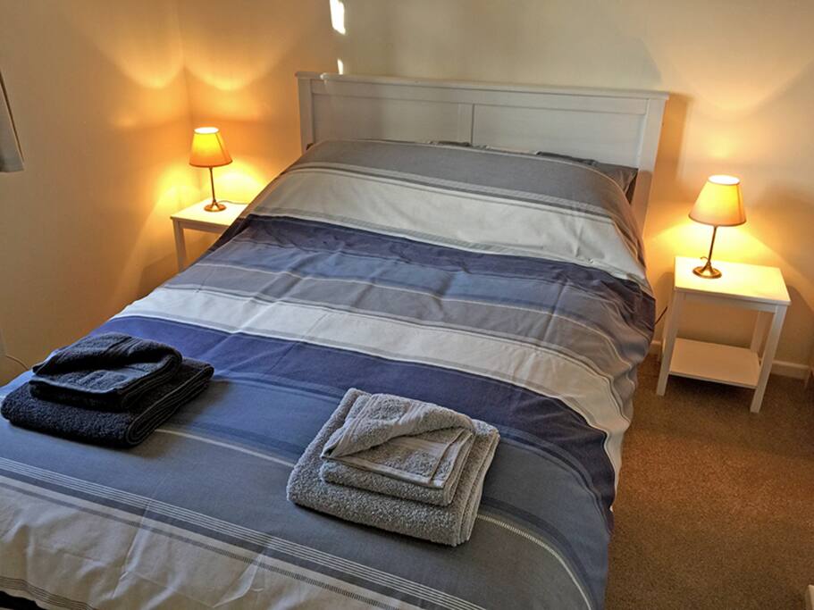 Master bedroom with chest of drawers and wardrobe