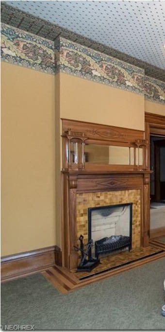 The room is pleasantly furnished with a queen sleigh bed and 1870 writers desk. The fireplace accents the art nouveau decor.