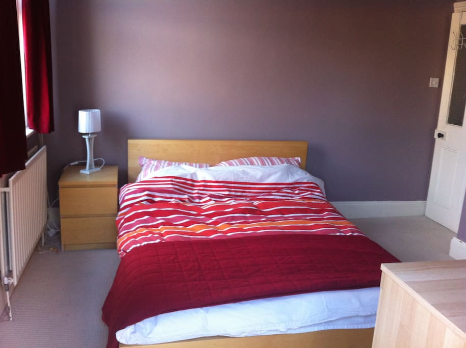 Double bed, bedside table, lamp