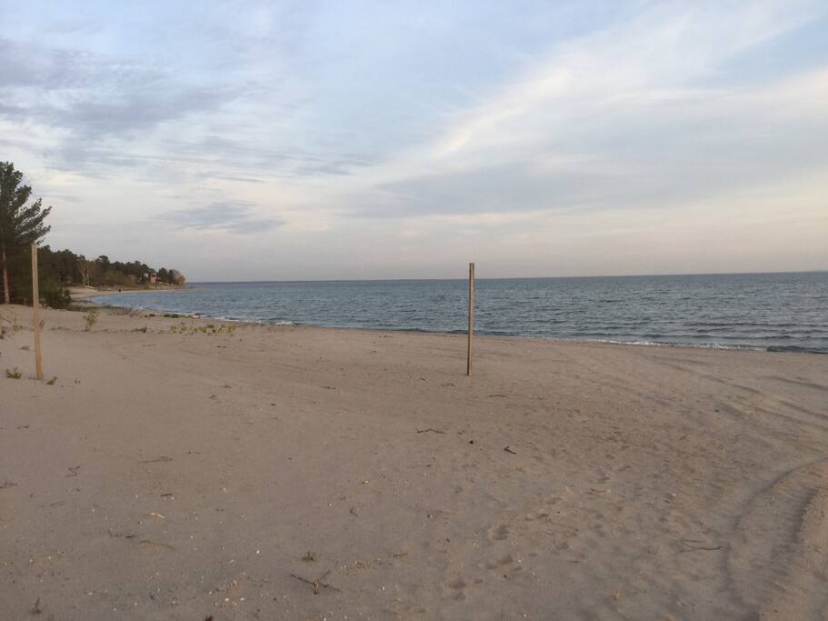 Sandy beach to the left of the cottage