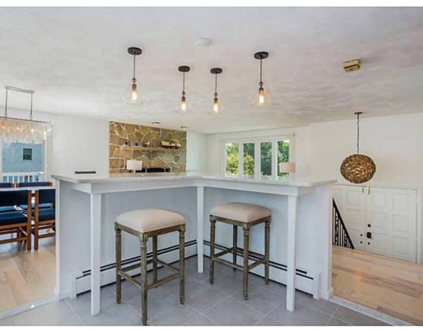 Granite countertops and a breakfast bar.