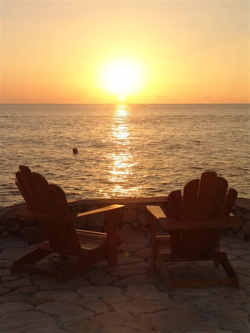Sit and enjoy the ambiance while sipping at a cold Red Stripe, Sunset Happy Hour!