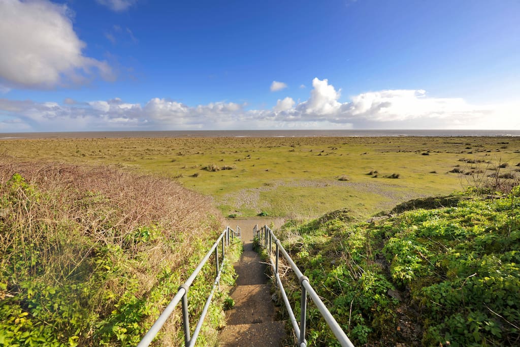 Steps in front of chalet leading to beach