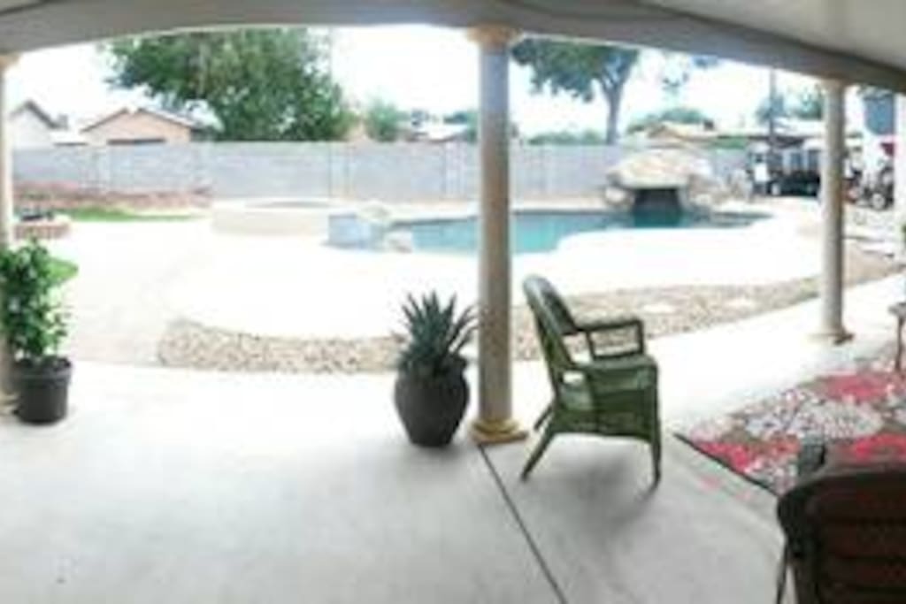 Relax on the back deck and with views of the pool hot tub and fire pit!