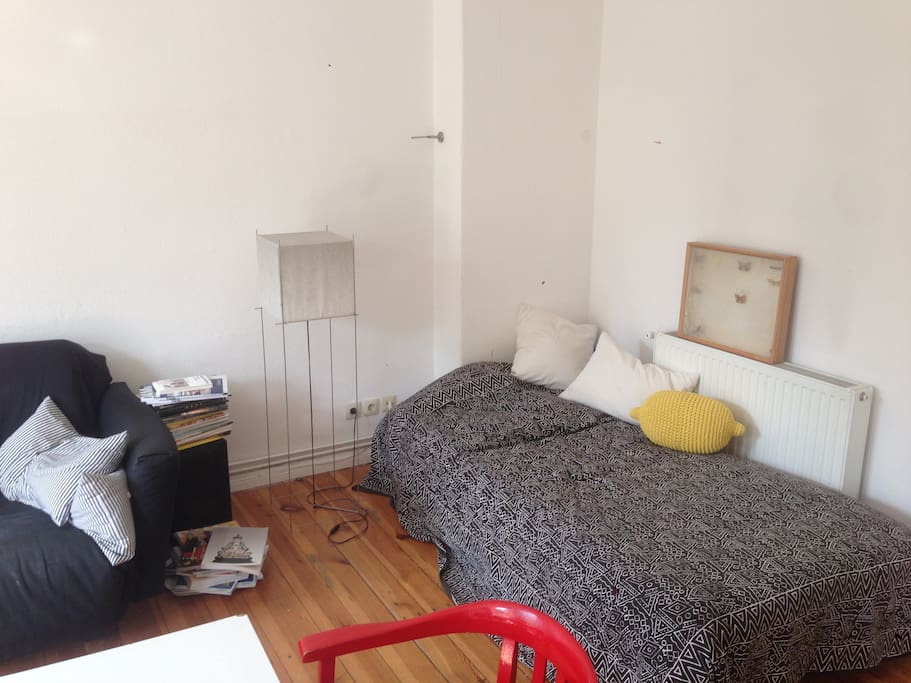 Big room with single bed and couch