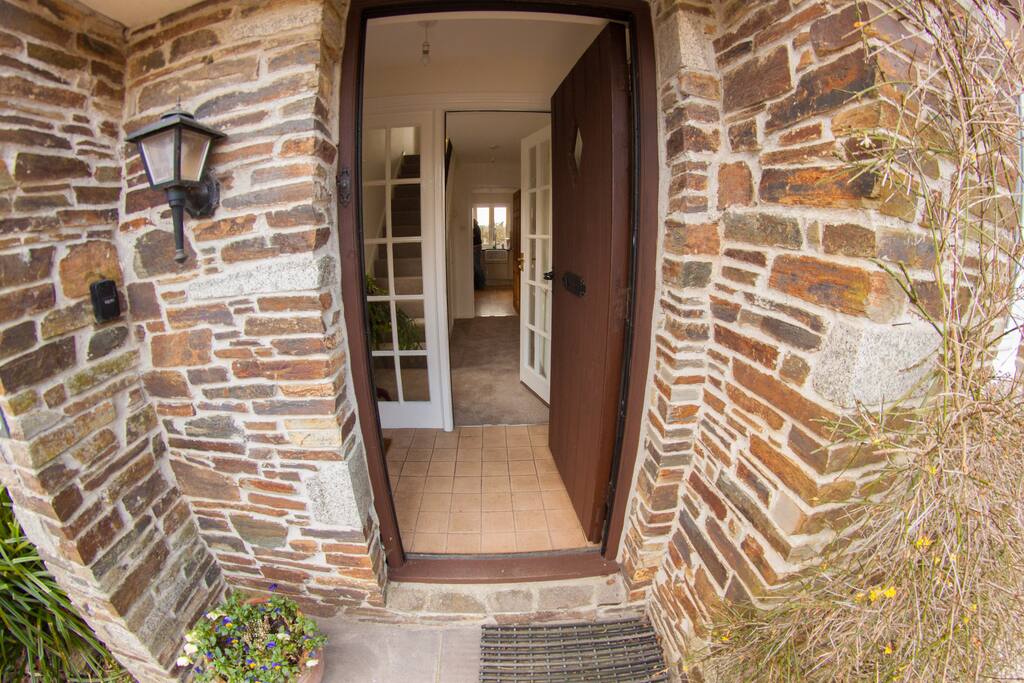 Through the keyhole... The tiled porch is ideal for dirty boots after a day on the moor. There is a downstairs toilet to the right.