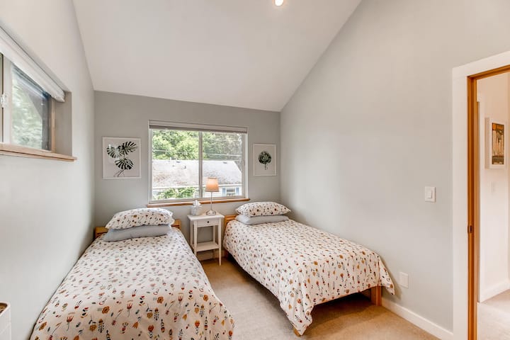 Second bedroom with two twin beds, large east facing window. Blackout blinds that darken room.