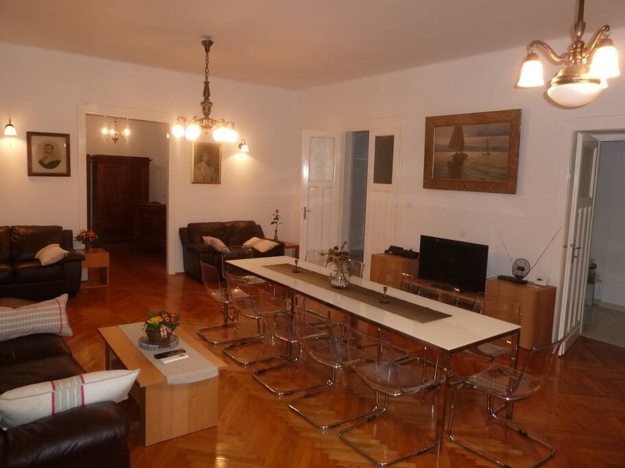Living room table for 8 can be combined with kitchen table to form sitting for 12
