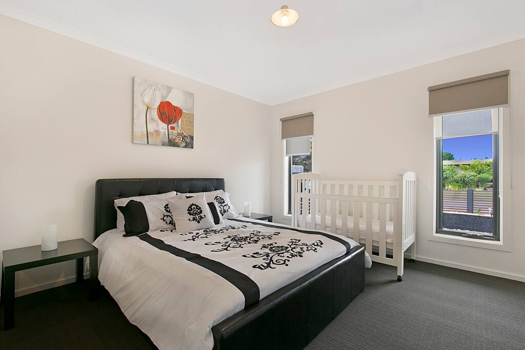 Bedroom 1 with ensuite and Cot