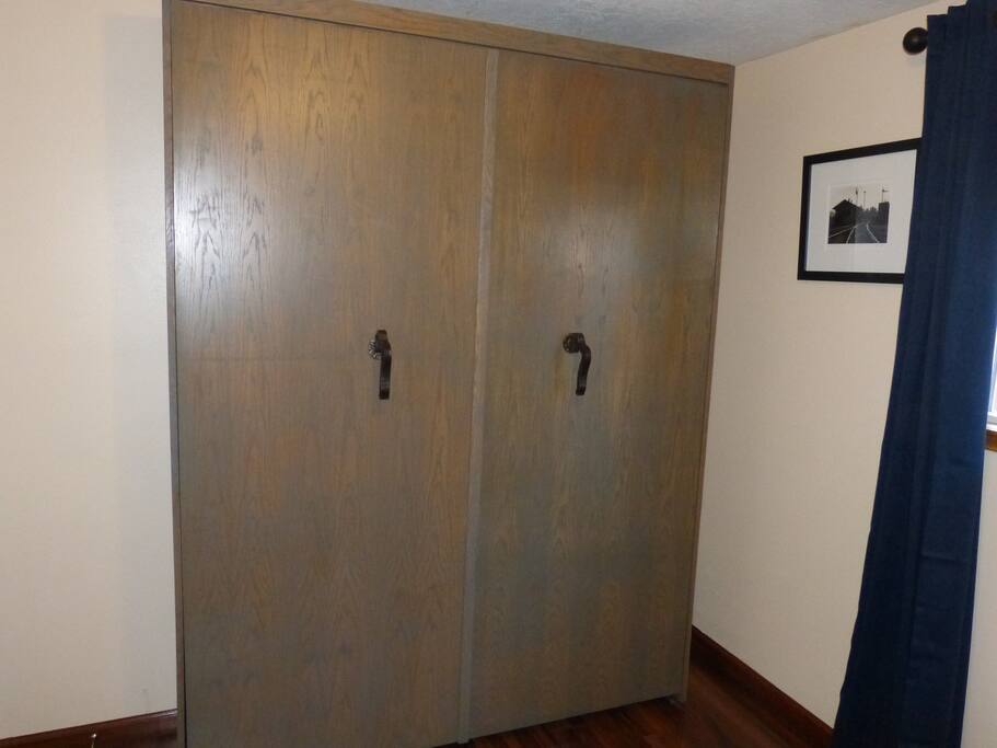 Custom made queen size Murphy bed with 12 inch mattress.