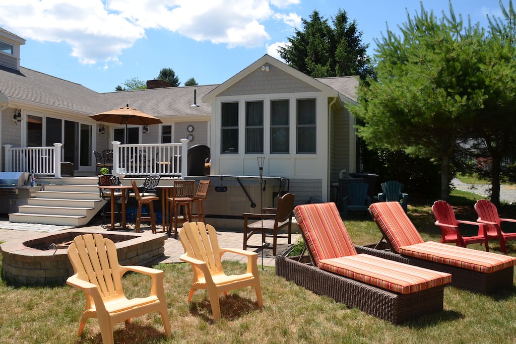 Large deck with hot tub, firepit, patio, lg stainless grille, and plenty of seating.