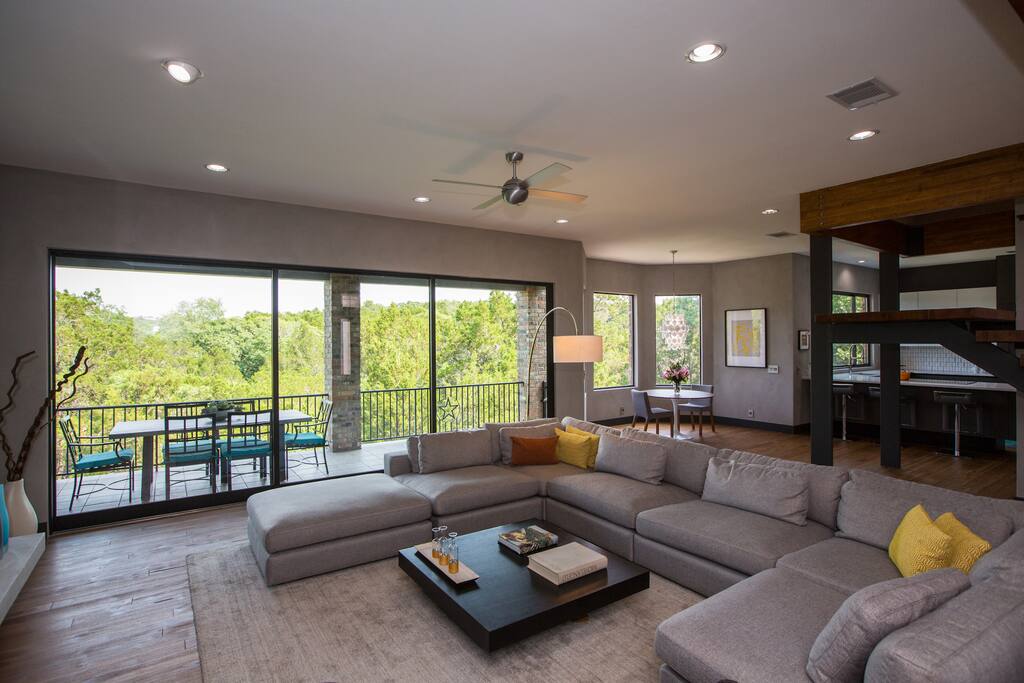 Sliding glass wall that opens to the patio and infinity-edge pool and spa!